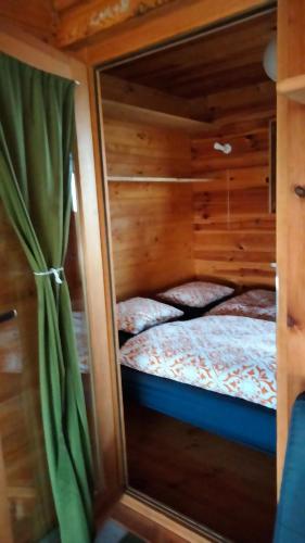 a bedroom with two bunk beds in a cabin at Osada Kabardia in Nowica