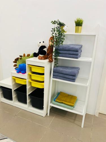 a room with two white shelves and towels at Homestay Alor Setar Nearby Hospital Sultanah Bahiyah in Alor Setar