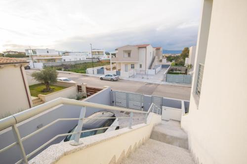 a balcony with a view of a street at Artemisia Home in Olbia