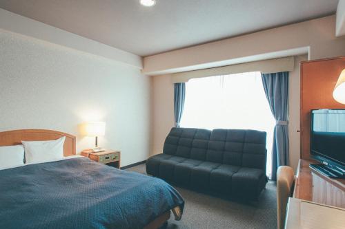 Televisyen dan/atau pusat hiburan di Hotel Villa Kuretake