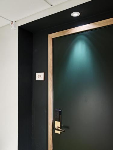 a door with the number on it in a room at Öijared Resort in Floda