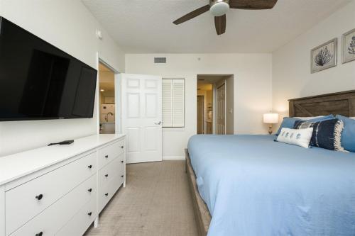 a bedroom with a bed and a flat screen tv at Unit 2320 Ocean Walk - 2 Bedroom Ocean View in Daytona Beach