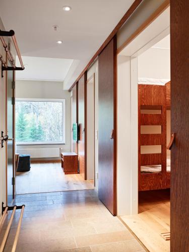 a hallway with a room with a bunk bed at Öijared Resort in Floda