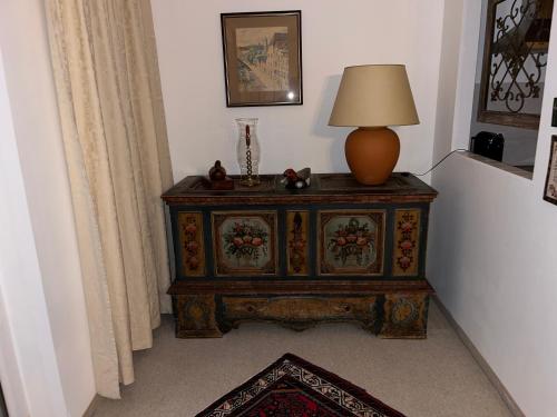 a lamp on top of a dresser in a room at Appartement Gernot in Kirchberg in Tirol