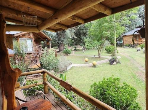 a view of a yard from a balcony of a house at Pualy Resort & Spa in Belén de Escobar
