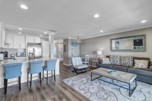 a living room and kitchen with a couch and a table at PVB Wellness Retreat in Ponte Vedra Beach
