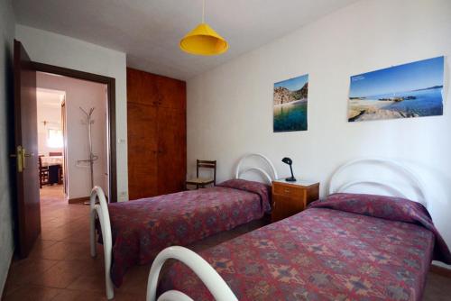 Un pat sau paturi într-o cameră la Appartamenti Salusai