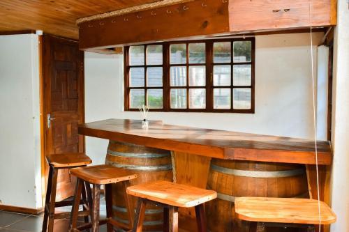 a bar made out of wine barrels in a room at MTH in Nelspruit