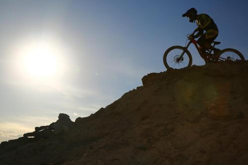 a man riding a bike on top of a hill at Staybridge Suites - Denver North - Thornton by IHG in Thornton