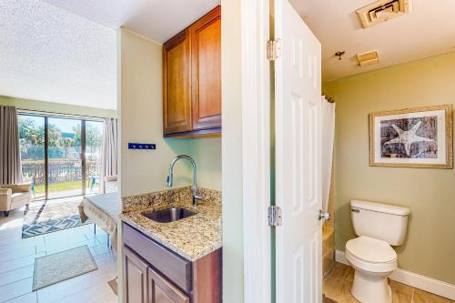a bathroom with a sink and a toilet at Pirates Bay B109 in Fort Walton Beach
