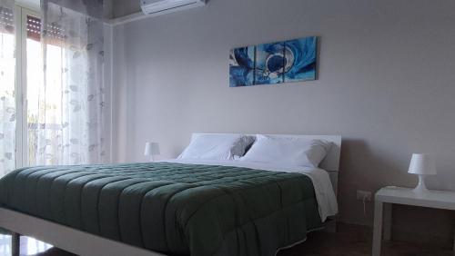 Postel nebo postele na pokoji v ubytování Amunì rooms and suite LT