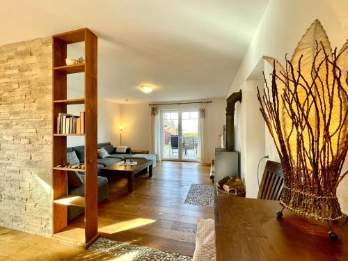 a living room with a couch and a table at Ferienwohnung Magma in Lutzerath