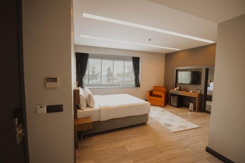 Postel nebo postele na pokoji v ubytování Peerless Villas Hotel