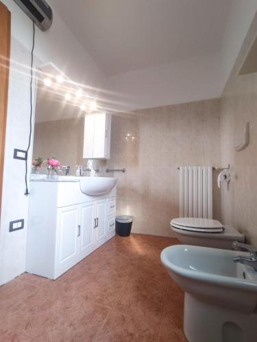 a bathroom with a sink and a toilet at 1000MigliaHouse in Brescia