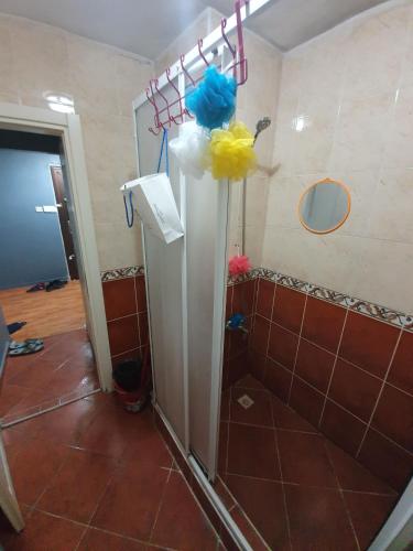 a bathroom with a shower with balloons on the wall at Private Room in Istanbul #77 in Istanbul