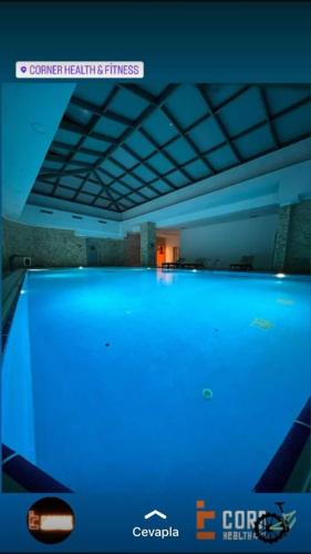 a large swimming pool with blue lighting in a room at Private Room in Istanbul #78 in Istanbul