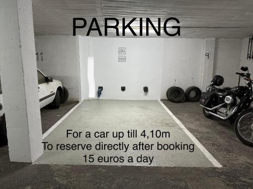 a parking garage with a car up till to reserve directly after at Casa Peña in Málaga