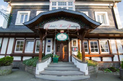 a building with a sign on the front of it at Lahntalhotel Feudingen in Bad Laasphe