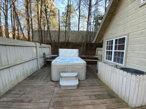 a toilet sitting on a deck next to a house at Misty Mountain Cabin in Gatlinburg