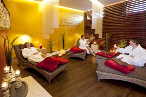 a group of people sitting in a room with beds at Best Western Hotel Hohenzollern in Osnabrück