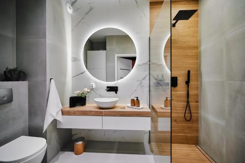 Et badeværelse på Przytulny Apartament Greenwall