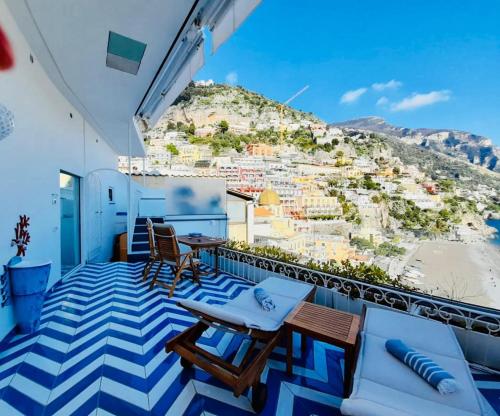 a balcony with a view of a hill at Villa Diamond Luxury Suite in Positano