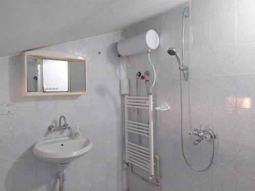 a bathroom with a shower and a sink at Villa Sofia in Chernomorets