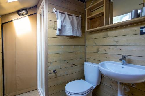a bathroom with a toilet and a sink at Resort Orizzonti Glamping in SantʼElpidio a Mare