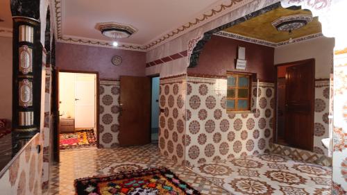 a room with a tile floor and a hallway at Dar Arghen Family Lodge in Imlil