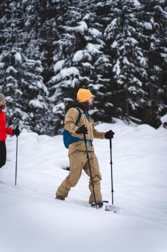 a man standing on skis in the snow at Alpinhotel Berghaus spa in Tux