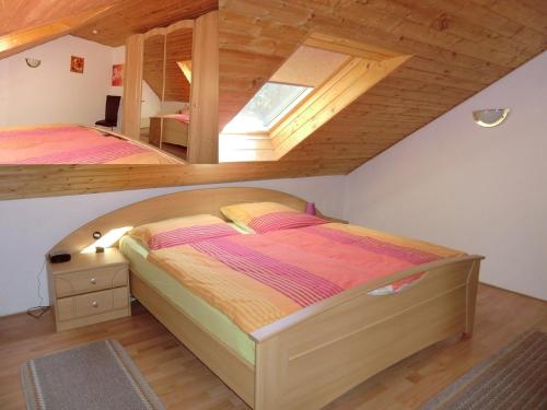 a bedroom with two beds in a attic at Ferienhaus Königreich - Dreistegen in Monschau
