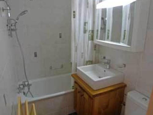 a bathroom with a sink and a shower and a toilet at Appartement Samoëns, 3 pièces, 6 personnes - FR-1-629-76 in Samoëns