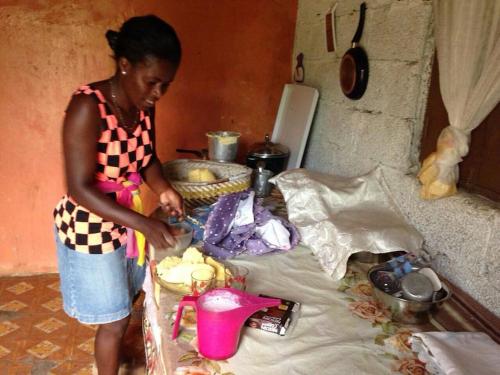 a woman standing in a kitchen preparing food at Kasa di Terra in Sacramento