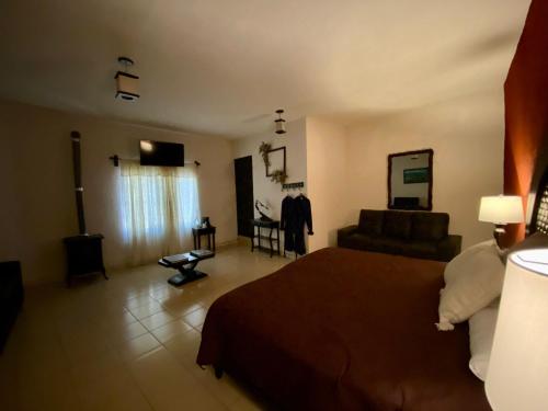 Ένα ή περισσότερα κρεβάτια σε δωμάτιο στο Hotel Boutique Calderon