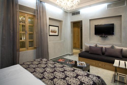 Cama o camas de una habitación en Riad L'Etoile D'Orient