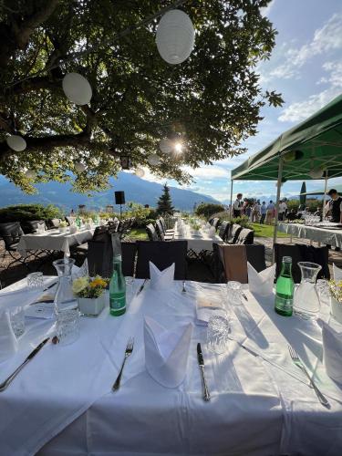 a table with a white table cloth on it at Hotel Restaurant Grünwalderhof in Innsbruck