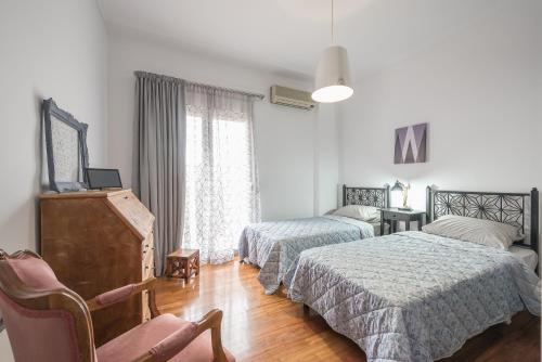 Ένα ή περισσότερα κρεβάτια σε δωμάτιο στο West Athens Studio