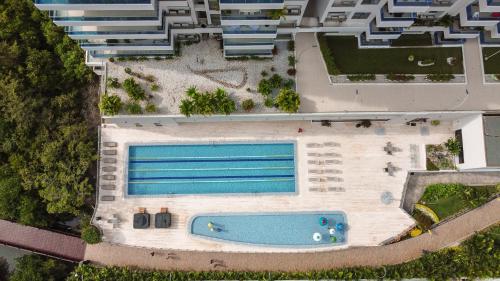 an aerial view of a resort with a swimming pool at Adela Suite in Santa Marta