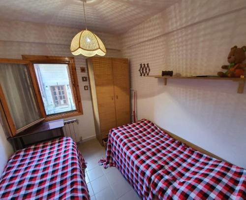 Postel nebo postele na pokoji v ubytování Relax in montagna