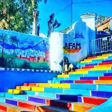 a colorful set of stairs in front of a building at Dar Casa Plasa Grande in Chefchaouene