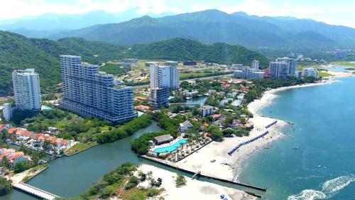 an aerial view of a resort on a beach at Adela Suite in Santa Marta