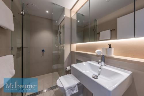 a bathroom with a sink and a shower and a toilet at Melbourne Private Apartments - Collins Wharf Waterfront, Docklands in Melbourne