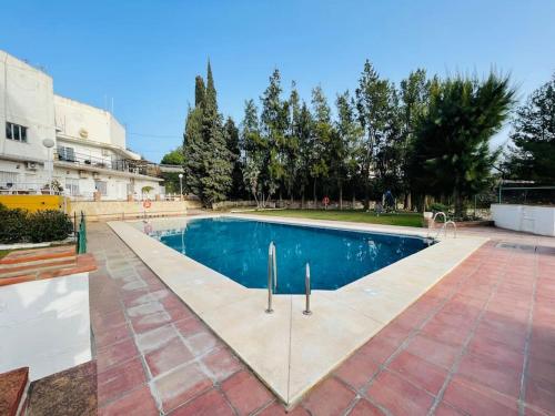 a swimming pool in the middle of a courtyard at Mijas Loft in Mijas