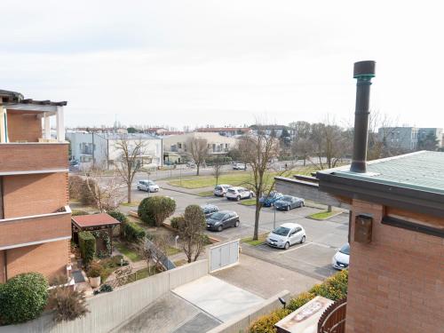 an aerial view of a parking lot with cars parked at Appartamento ISOTTA in Lugo