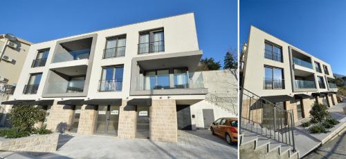an apartment building with a car parked in front of it at Solaris Lux Apartments in Kotor