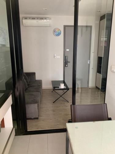 a living room with a couch and a table at the base in Pattaya Central