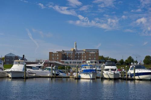 a group of boats docked at a dock in a harbor at Molly Pitcher Inn in Red Bank