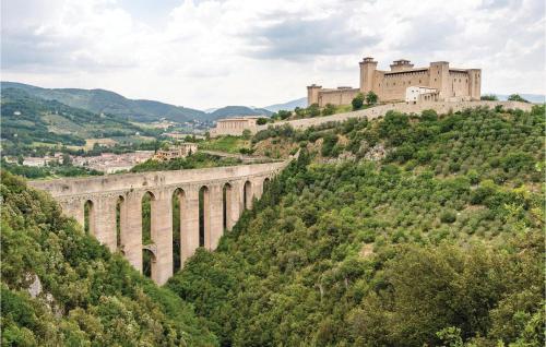 a bridge on a hill with a castle in the background at Roselli in Roselli