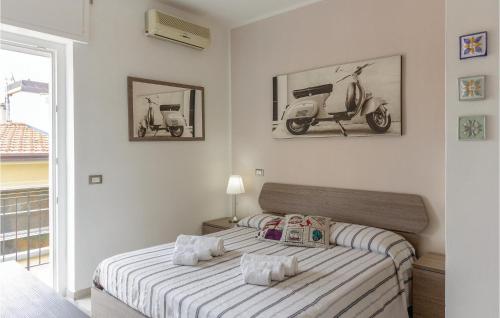 a bedroom with a bed with a vespa on the wall at Sul Mare in Lido di Camaiore
