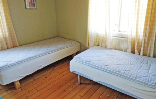 Ένα ή περισσότερα κρεβάτια σε δωμάτιο στο Holiday Home Tranemåla Strömsnäsbruk